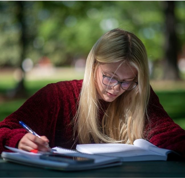 Katelyn Watson, a biomedical engineering major studies for finals at the Grove on May 3, 2023. Photo by Srijita Chattopadhyay/ Ole Miss Digital Imaging Services