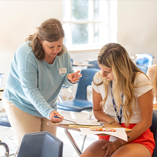 A business advisor helping an incoming student.