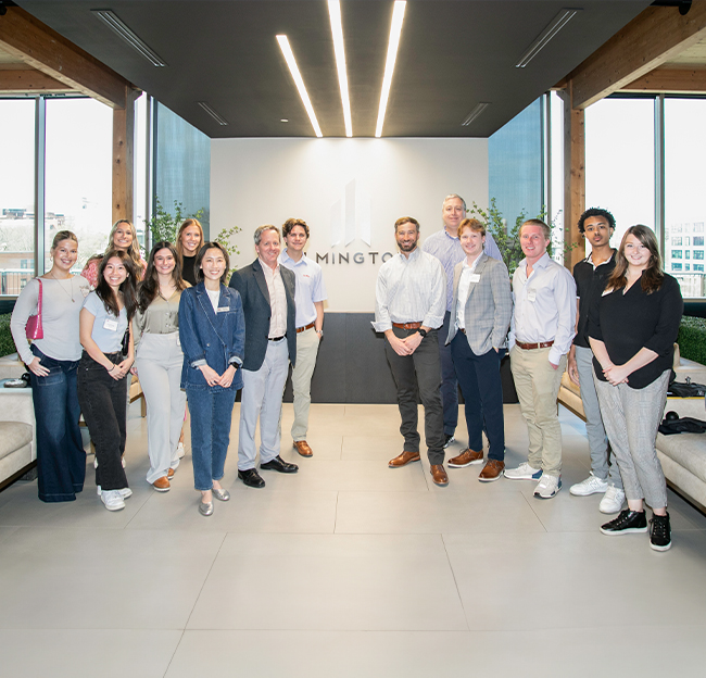 Group photo of students, faculty, staff, and owners at Elmington Property Management in Nashville, TN.