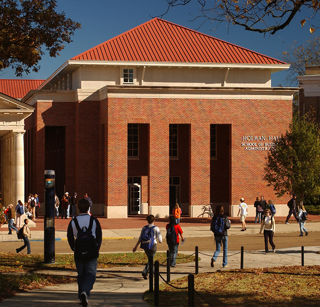 Front of Holman Hall during a fall season.