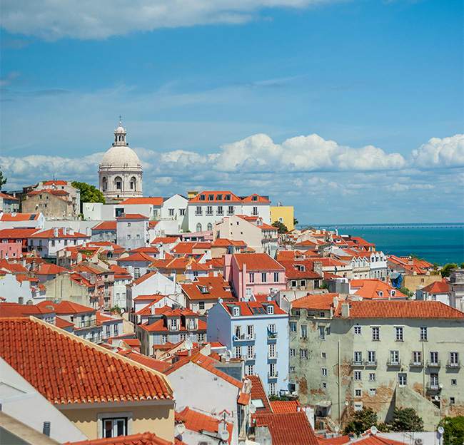 Photo of a skyline of houses and buildings of Lisbon.