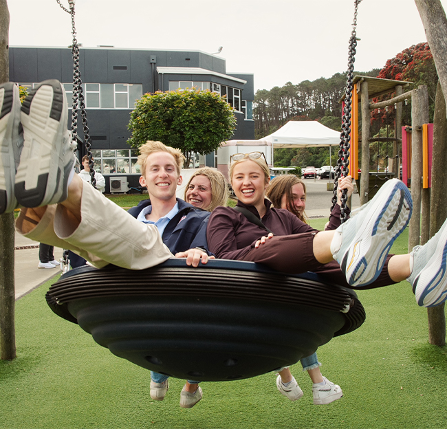 Students on a swing in New Zealand.