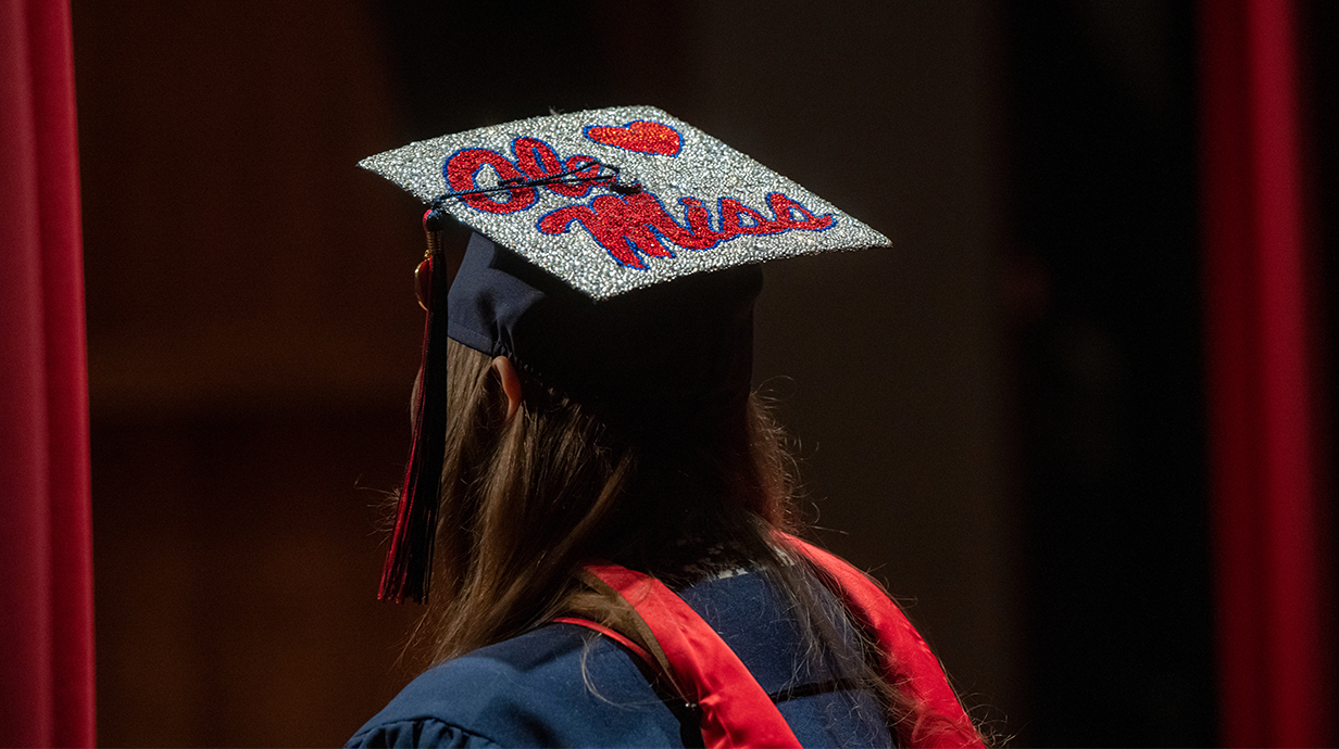 Bedazzled cap with "Ole Miss' on it during a MBA Commencement.