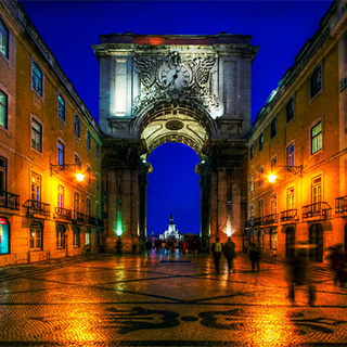 Night photo of a street in Lisbon.