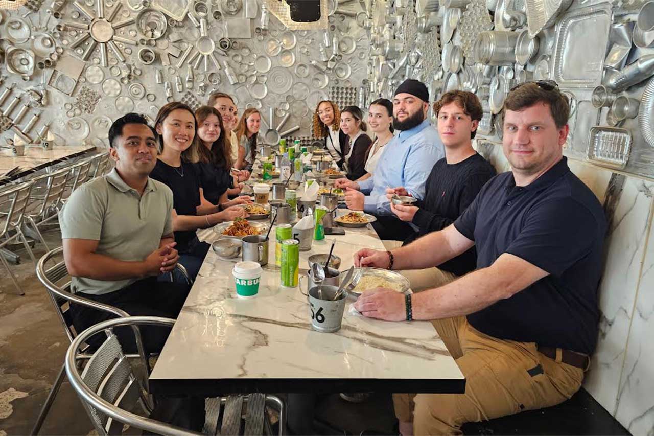 Tong Meng having a meal in Singapore with her students during a Study Abroad.