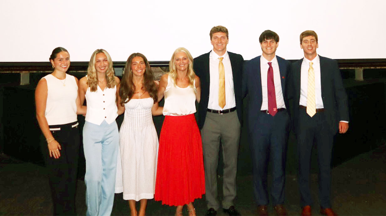Renie Anderson and a group of business students after her lecture.