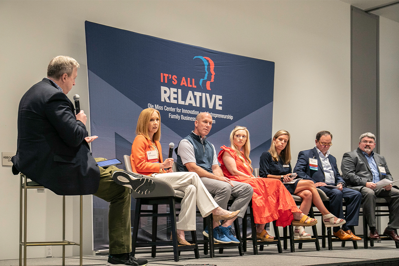 A group of individuals on a panel discussion during the 2023 Family Business Symposium