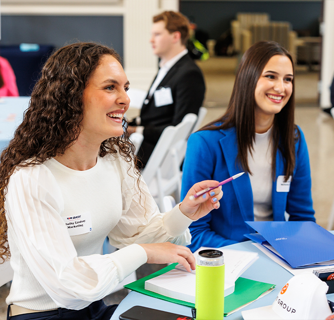 two students during the spring BASE summit event.