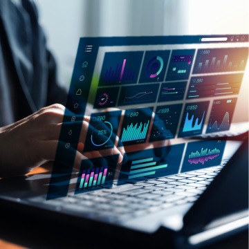 Canva Image: Close-up of a professional using a laptop with a transparent analytics dashboard, visualizing AI-driven reporting, business intelligence, data insights, and digital workflow.