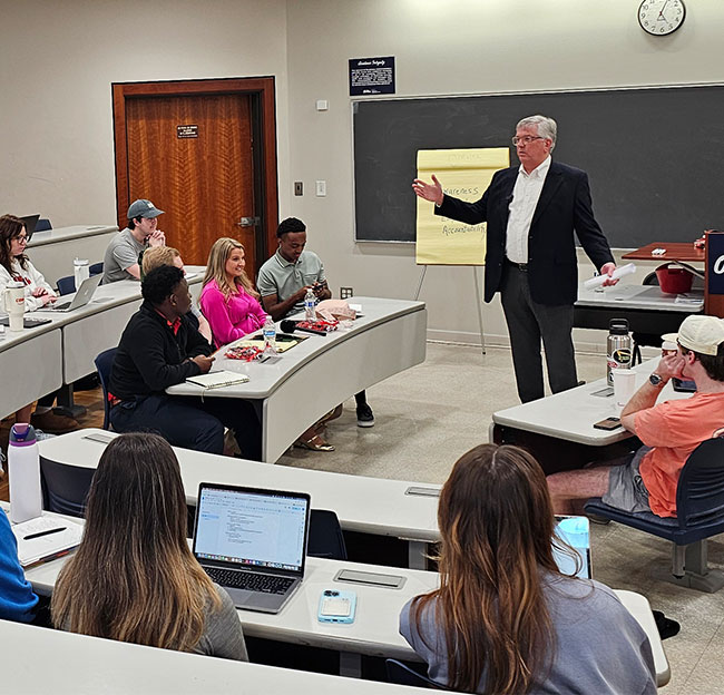 Classroom of students in Conner Hall during a Business Success event.