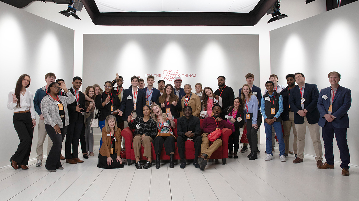 Group photo of students, faculty, and staff at the Chick-fil-A Support Center in Atlanta.