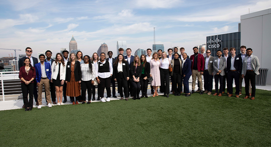 Group photo of students and staff from the Ole Miss Business School with Cisco employees.