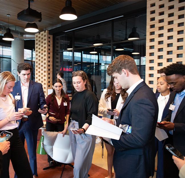 Students connecting with an employee at Microsoft using the LinkedIn app.