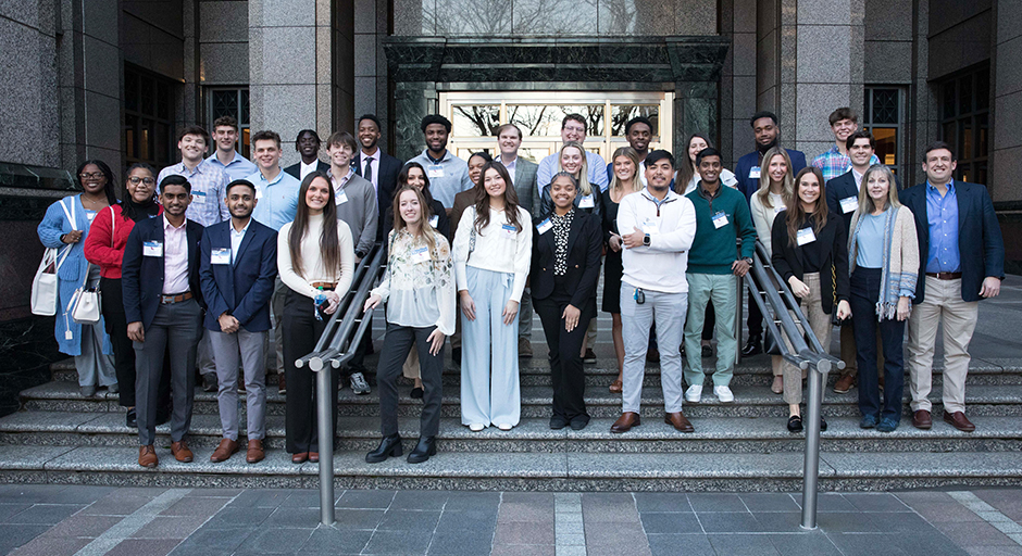 Group photo of students and staff from the Ole Miss Business School at Northwestern Mutual in Atlanta.