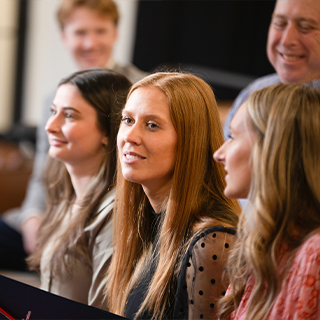 A group of students listening to a presentation during a visit in Nashville.