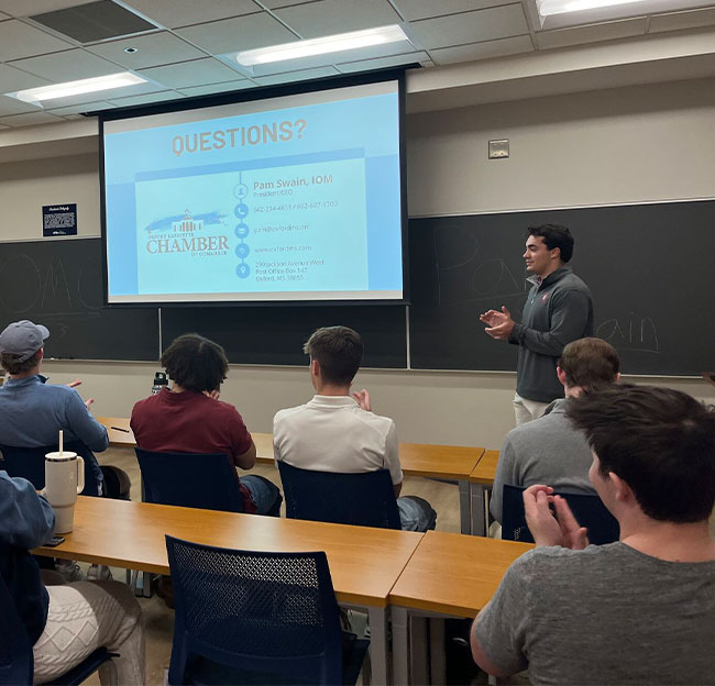 Ole Miss Business Club meeting with students and guest speakers.