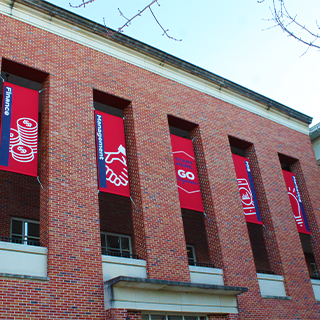 Photo of banners outside Holman Hall.