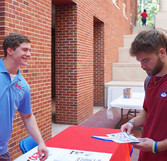 Photo of two students during the Open for Business event.