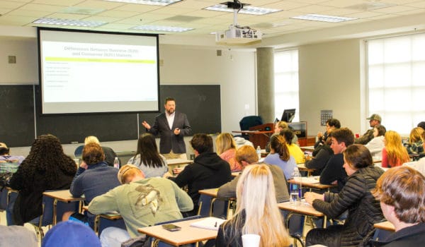 Dr. Matt Shaner teaches marketing to a classroom of marketing students